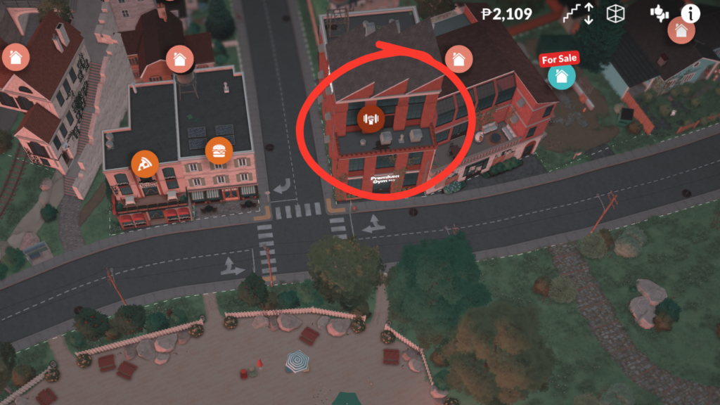 This is a screenshot from Paralives. This image shows the location of the gym near the beach. The gym building is circled in red. 